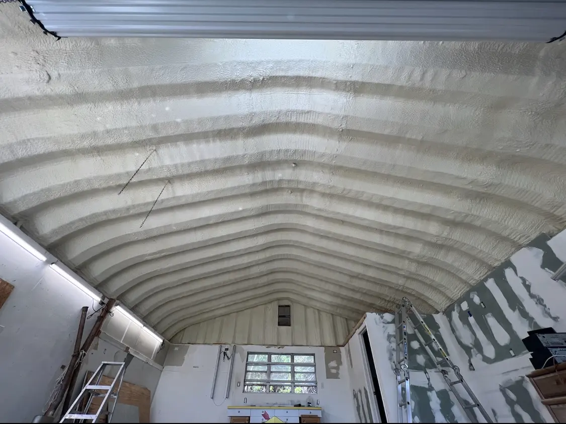 Spray polyurethane foam applied to the underside of a metal roof deck in Alexander City